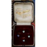 A cased set of 4 9ct gold dress studs, set with an opal