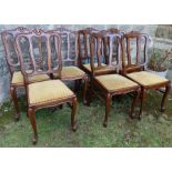 A set of eight continental style dining chairs