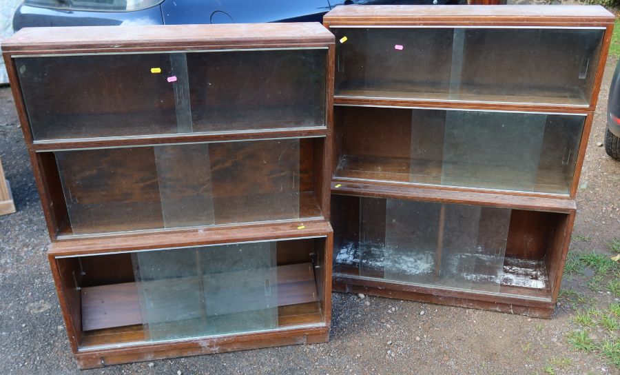 Two oak bookcases, with glazed sliding fronts, 35ins x 11.5ins, height 43ins