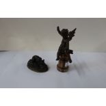 Y Mongmiey, metal model of a dog, length 4.5ins, together with a metal cherub on a column base,