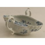 A Worcester two handled moulded sauce boat painted in underglaze blue