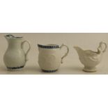An early Worcester sauce boat, shell moulded cream boat and barrel shaped cream jug