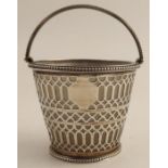 A pierced silver pot, with frosted glass liner and swing handle, London 1816, height including