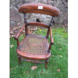 A 19th century style child's chair with caned seat