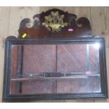 An Antique rectangular wall mirror, with fret cut decoration to the top and gilt basket of