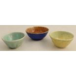 Three Ruskin pottery bowls, decorated with matt crystalline glazes, diameter 2.75ins and down