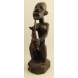 A wooden Congo fertility figure, height 22ins