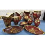 A collection of Crown Devon rouge royale, to include a pair of covered vases, vases, dishes, covered