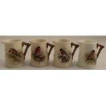 Four Royal Worcester barrel moulded jugs, decorated with a Bullfinch, a Linnet, a Stonechat and
