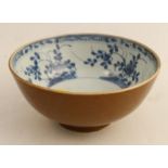 An 18th century Chinese blue and white bowl, with cafe au lait exterior, diameter 6ins