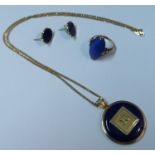 A 14k gold and lapis lazuli pendant, on 14k fine link chain together with a lapis lazuli ring and