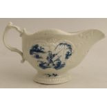 A Worcester sauce boat, painted in underglaze blue with landscapes and a fisherman, width 8ins -