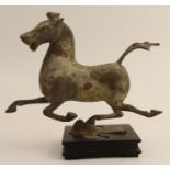 A Chinese cast metal Tang dynasty style horse, in striding position on wooden base, height 6.5ins