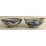 2 blue and white Delft bowls decorated with landscapes and foliage