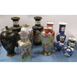 A collection of Carlton Ware vases, and a pair of covered pots, all decorated in various