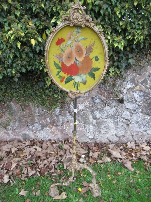 A pole screen, with ornate gilt decoration