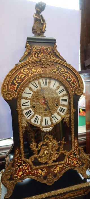 A 20th century Tiffany French Louis XV style mantel clock, with Boulle style decoration, on a