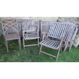 A collection of garden furniture to include stacking metal chairs, 11 folding danish design