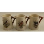 Three Royal Worcester barrel moulded jugs, decorated with a Swallow, a Redstart and a Long Tail Tit,