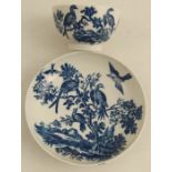 A Worcester tea bowl and saucer printed in underglaze blue with birds