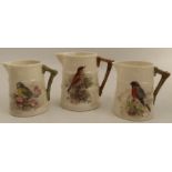 Three Royal Worcester barrel moulded jugs, decorated with English birds by W Powell, height 3.