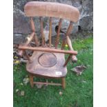 An Antique elm seated child’s commode chair
