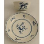 A Worcester tea bowl and saucer printed in underglaze blue with fruit