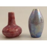 Two Ruskin pottery miniature vases, one in a pink glaze the other in a purple glaze, height 1.75ins