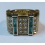 An 18ct gold diamond and emerald ring