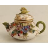 A Continental porcelain miniature tea pot, encrusted with flowers, cross swords mark to base, height