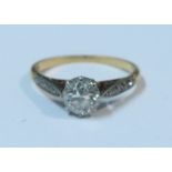 An 18ct gold and platinum diamond ring, claw set old cut diamond of approximate 0.75ct, with four