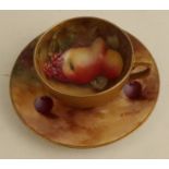 A Royal Worcester miniature tea cup and saucer by Ayrton and Everett