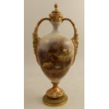A Royal Worcester covered pedestal vase, decorated to the front with sheep in rocky landscape by