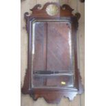 An Antique mahogany framed wall mirror, with shell and scroll decoration, bevelled glass plate,