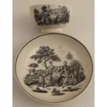 A Worcester tea bowl and saucer decorated with Hancock print The Tea Party, Maid and Page