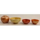 Four pieces of Ruskin pottery, all decorated in iridescent glazes of orange and yellow, af, height
