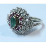 A 14k emerald, ruby and white stone ring, (possibly white sapphire), weight 9g