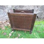An Arts and Crafts style magazine rack, width 17ins, height 18.5ins