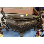 A Continental bronze jardiniere, with embossed Classical decoration