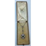 An Edwardian moonstone, diamond and sapphire pendant, in fitted leather case for Goldsmiths and