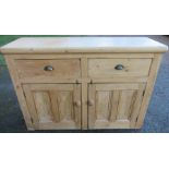 A pine sideboard, fitted with two drawers over two cupboards, 55ins x 17ins, height 39ins
