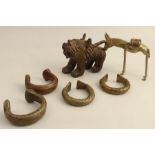 A cast metal model of a cat, together with one of a horse and various bangles