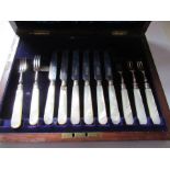 2 canteens, including silver and mother of pearl fish knives and forks