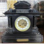 A Victorian black slate mantel clock, together with a mahogany wall bracket