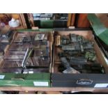 A collection of boxed army vehicles and a box of tanks