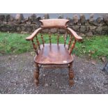 An oak captain's chair