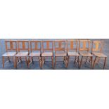 Eight beech and elm chairs, two with book holders to the back