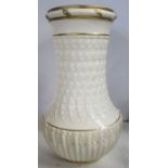 A Royal Worcester vase, with leadless glaze, the white body embossed with flowers, height 8.