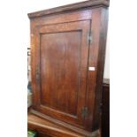 A 19th century oak corner cupboard, width 30ins