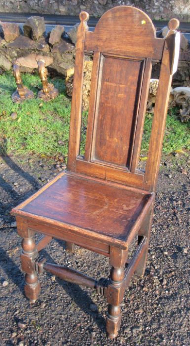 An Antique oak hall chair, with solid seat